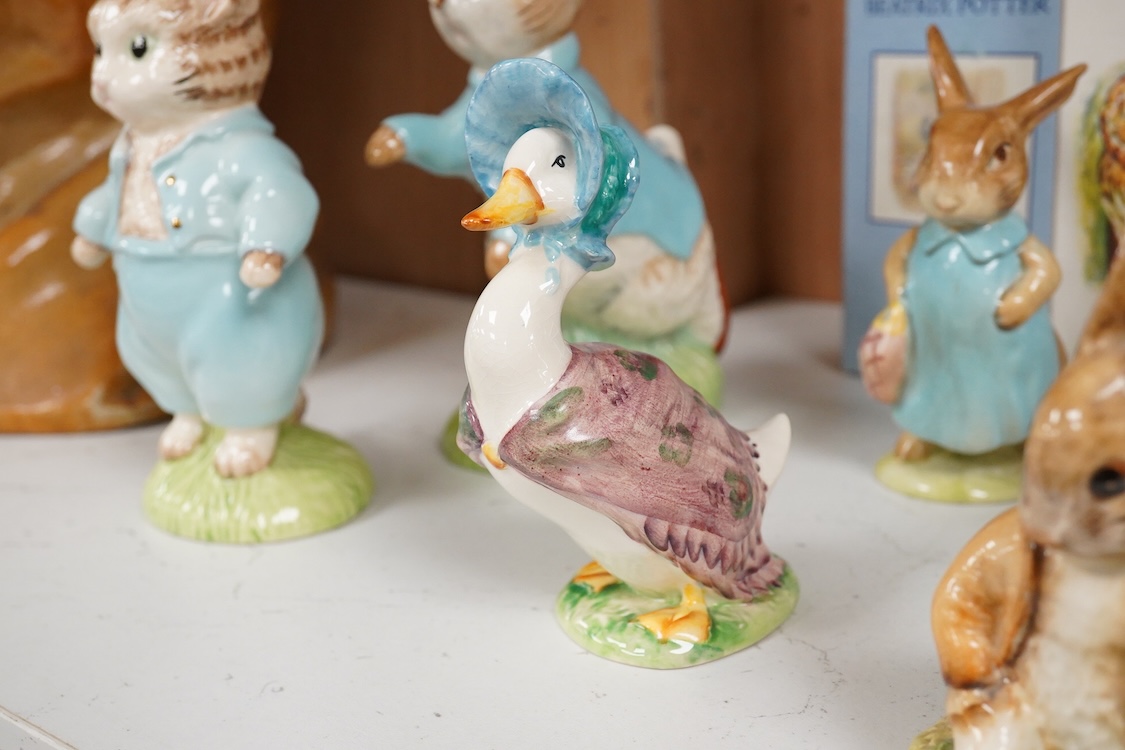 Nine Beswick Beatrix Potter figures, some stamped F. Warne & Co , largest 17cm high
